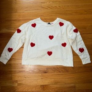 Cream Sweatshirt with Red Heart Accents